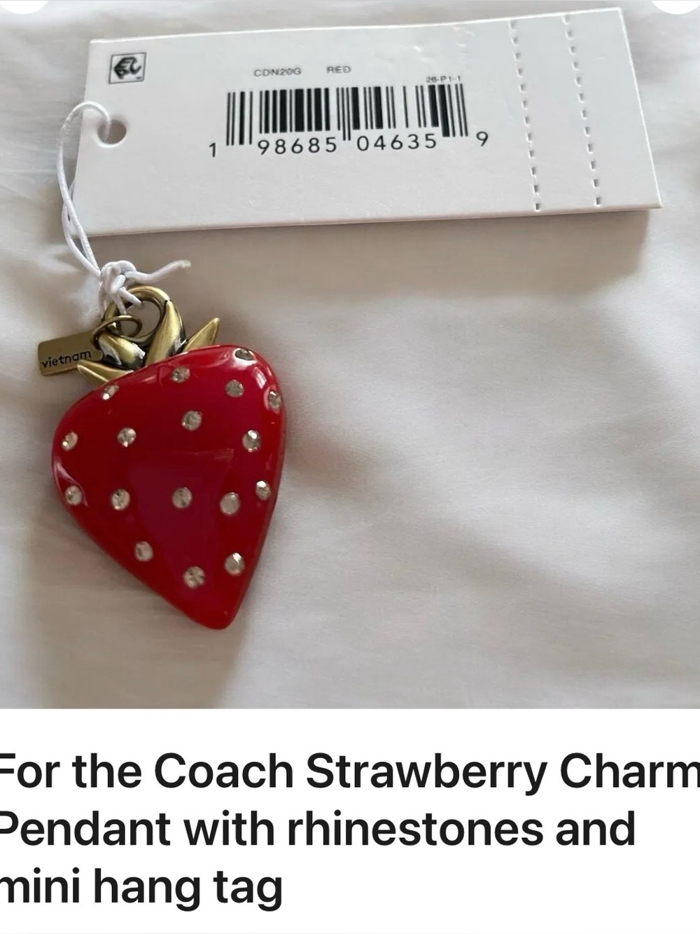 Coach NWT
Strawberry Charm
Pendant with rhinestones and mini hang tag